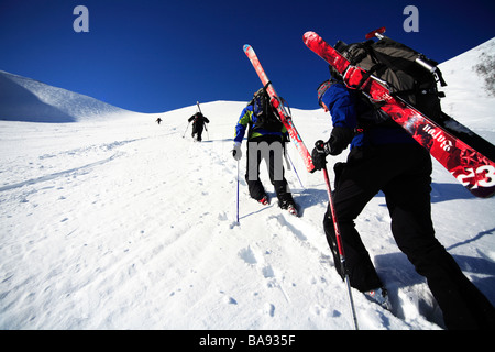 Skiers climbing a mountain Lapland Sweden Stock Photo