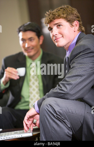 Businessmen using laptop taking  coffee break Stock Photo