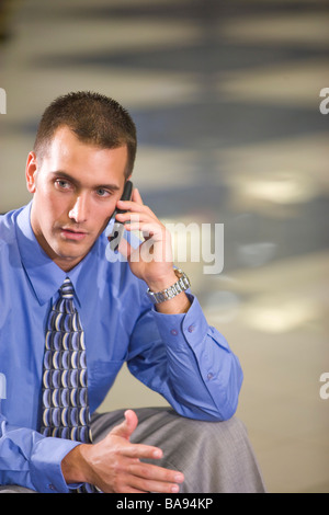 Close-up portrait of serious businessman on mobile phone Stock Photo