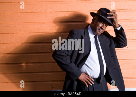 Portrait of senior African American man in suit and fedora hat Stock Photo