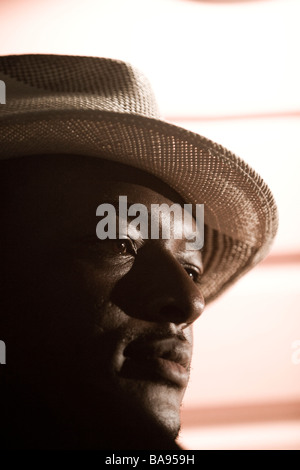 African American man wearing fedora hat Stock Photo