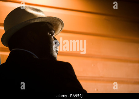 African American man wearing fedora hat Stock Photo
