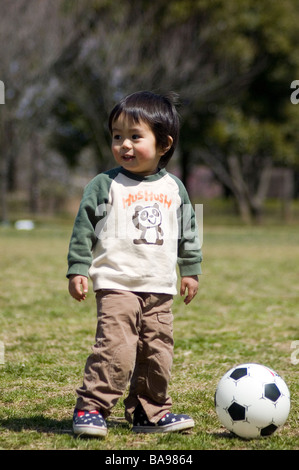 Japanese boy with ball Stock Photo