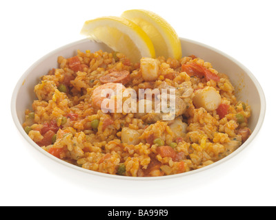 Freshly Prepared Spanish Style Seafood Paella Meal Isolated Against A White Background with No People And A Clipping Path Stock Photo