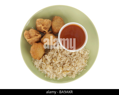 Freshly Cooked Authentic Chinese Style Sweet and Sour Chicken Balls With Rice Isolated Against A White Background With No People And A Clipping Path Stock Photo