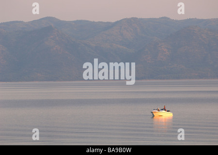 Fishing on Lake Kariba boat fishing off a boat leisure fun sport tourism tourists Zimbabwe water fresh water fish Stock Photo