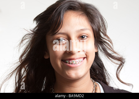 Hispanic teenager girl with dental braces wearing sleep mask and robe  celebrating victory with happy smile and winner expression with raised  hands Stock Photo - Alamy