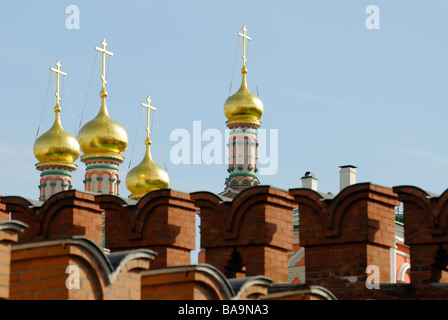 Golden domes of Russian church behind a Kremlin wall Moscow Russia Stock Photo