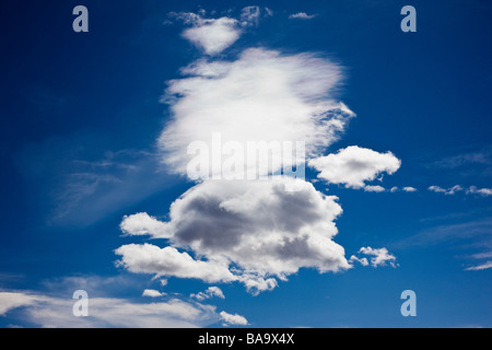 Puffy white clouds on a clear blue sky near Placerville Colorado USA Stock Photo