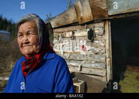 A First Nations female elder wears a head scarf in the community of Old Crow, Yukon Territory, Canada. Stock Photo