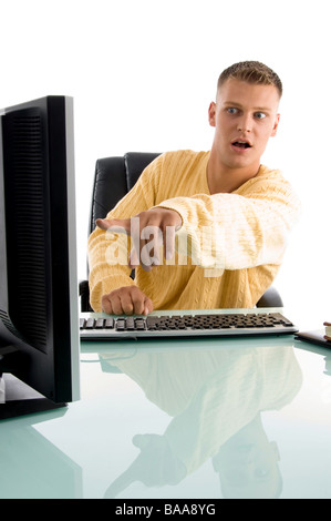 man pointing on computer screen Stock Photo