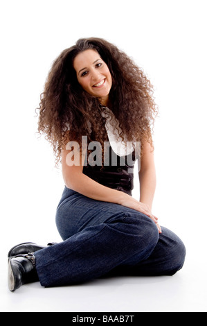 smiling woman sitting on the floor Stock Photo