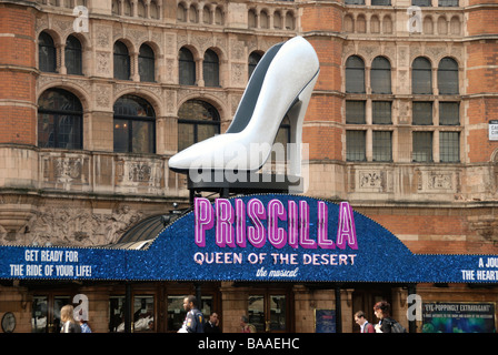 Neon sign and giant shoe promoting the musical Priscilla Queen of the Desert outside the Palace Theatre Shaftesbury Ave London Stock Photo