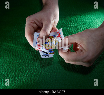ripping up a pair of playing cards Stock Photo