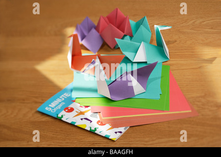 Origami swans Making things from paper Stock Photo
