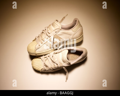 Old pair of trainers sneakers Stock Photo