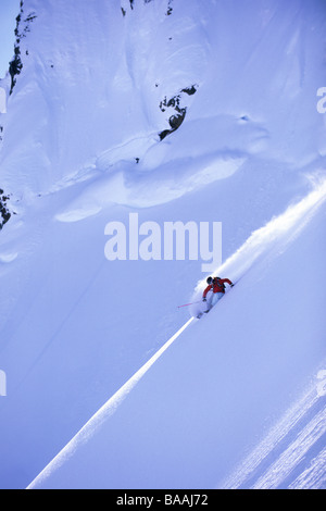 Woman big mountain skiing in Haines, Alaska. Stock Photo