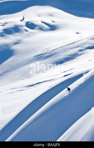 Woman big mountain skiing In the Chilkat Mountains near Haines, Alaska. Stock Photo