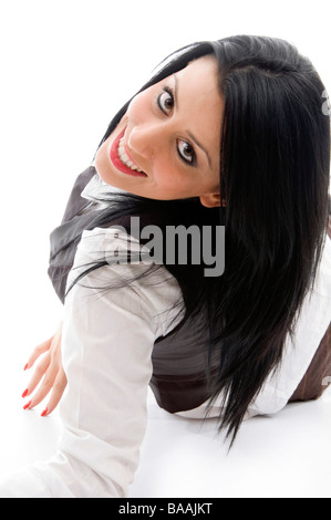 american woman lying on floor and looking backwards Stock Photo