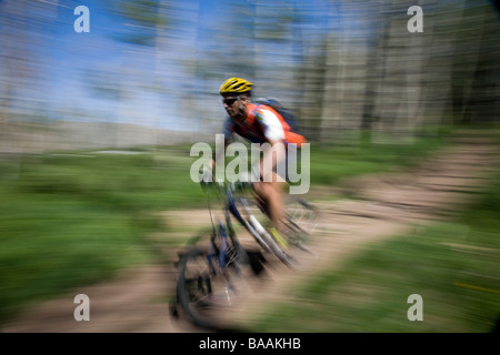 Blurred mountain biker in the Abajo Mountains near Montecello, Utah.