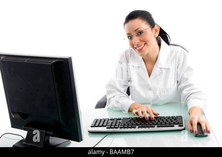 front view of smiling doctor working on computer on white backgr Stock Photo