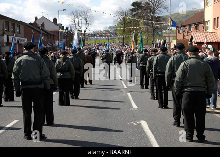 marchers in jackets and trousers march on Easter Sunday as part of the Easter Rising Commemoration Falls Road Belfast Stock Photo