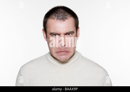 Portrait of an handsome expressive man in studio on white isolated background Stock Photo