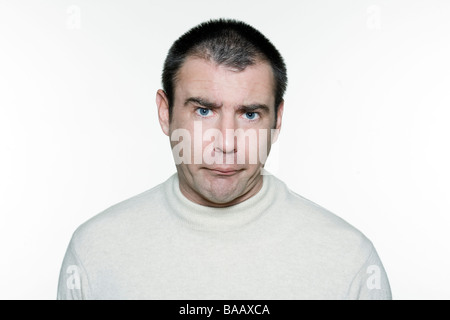 Portrait of an handsome expressive man in studio on white isolated background Stock Photo