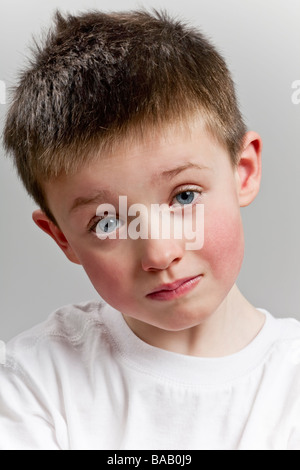 Sad little boy looking to camera Stock Photo