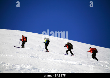 Skiers climbing a mountain Sweden Stock Photo