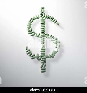 green pills laid out in the dollar money sign symbol on gray white background Stock Photo