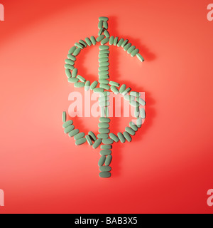 green pills laid out in the dollar money sign symbol on red background Stock Photo