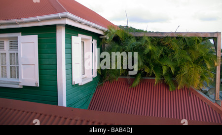 Traditional red tin roof and wooden clapboard building Gustvia St Barts Stock Photo