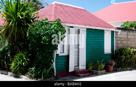 Tiny traditional wood shingle and shutter red tin roof house Gustavia St Barts Stock Photo