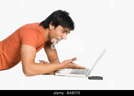 Man working on a laptop and surprised Stock Photo