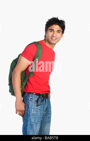Man carrying a bag and smiling Stock Photo