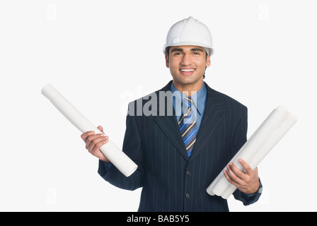 Architect holding blueprints Stock Photo