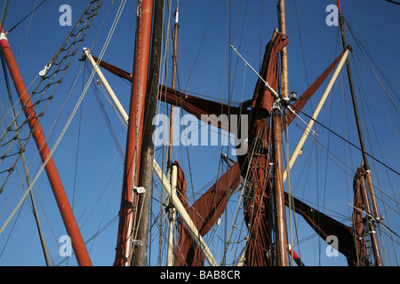 Masts and sails on Thames sailing barges moored at Hythe Quay in Maldon Essex Stock Photo