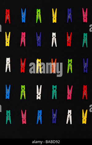 Coloured small clothes pegs pattern Stock Photo