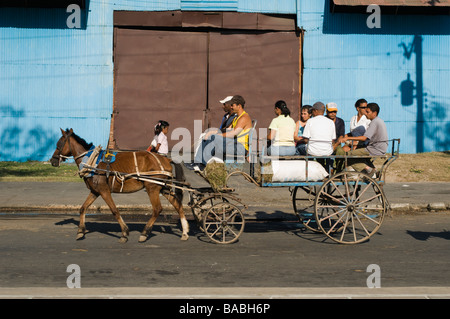 Horse drawn cart as taxi in the far west of Cuba in the city of Santiago de Cuba. Stock Photo