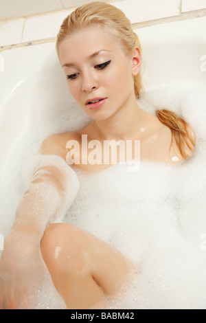 Blonde portrait with foam in the bath Stock Photo