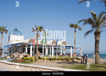 Paseo Maritimo Torremolinos Malaga Provice Costa del Sol Spain People enjoying  sunshine outside typical beachside chiringuito Stock Photo