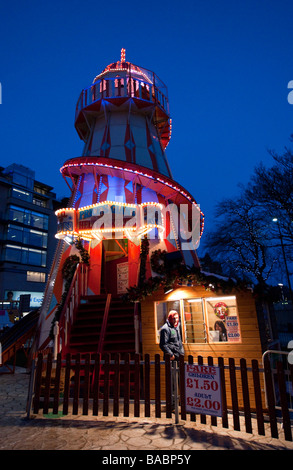Edinburgh December city at night the Christmas fairground in Princes Street Gardens helter skelter slide