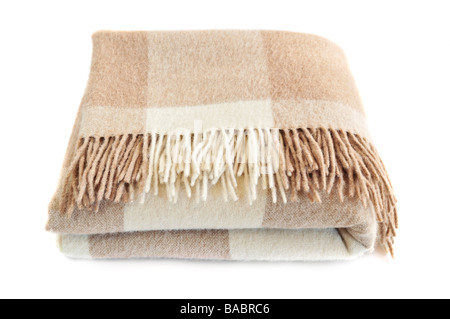 Soft and warm folded alpaca wool blanket with fringe Stock Photo