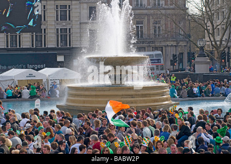 Crowds enjoying the musical entertainment in London's Trafalgar Square for the St Patricks day celebrations Stock Photo