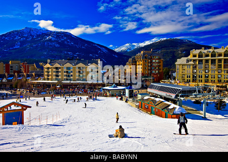 Skiers and snowboarders at the base of Whistler Mountain,Canada. Stock Photo