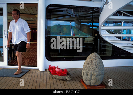 France, French Polynesia, Tia Moana Yacht, guest crossing the deck Stock Photo