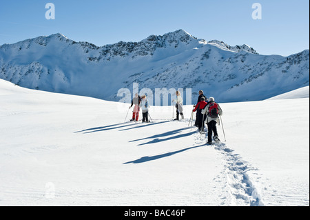 Group with a guide on snowshoe tour in the Bregenz Forest Stock Photo