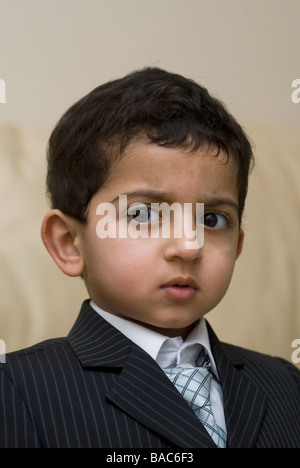 Serious young boy wearing a suit Stock Photo