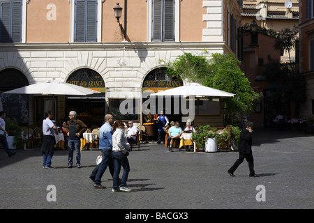Tourists at a bar on Santa Maria in Trastevere square, Rome, Italy. Stock Photo